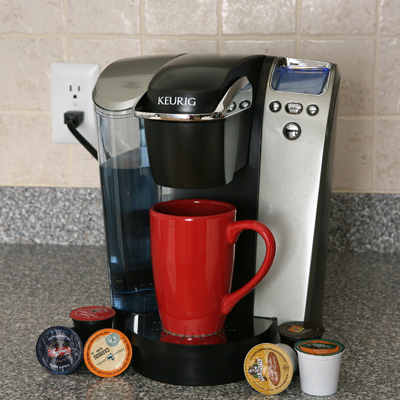 KEURIG® Gourmet Single Cup Brewing System - This single-cup home brewing system with one-touch controls allows you to brew a gourmet cup of coffee any time, with your choice of 5 cup sizes. Includes removable 60-ounce water tank. 