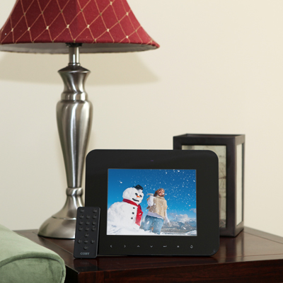 COBY® 8” Digital Photo Frame with Multimedia Playback - This digital photo frame is perfect to share your favorite photo memories. It features a sleek, contemporary frame with a glossy back design, vibrant 8” LCD screen, and easy-to-use front touch-sensitive controls. It also allows to set your photos to music with MP3 audio playback and watch your favorite digital home videos. A full-size USB port, multiple memory card slots, integrated speakers, calendar and alarm clock functions are also included.
